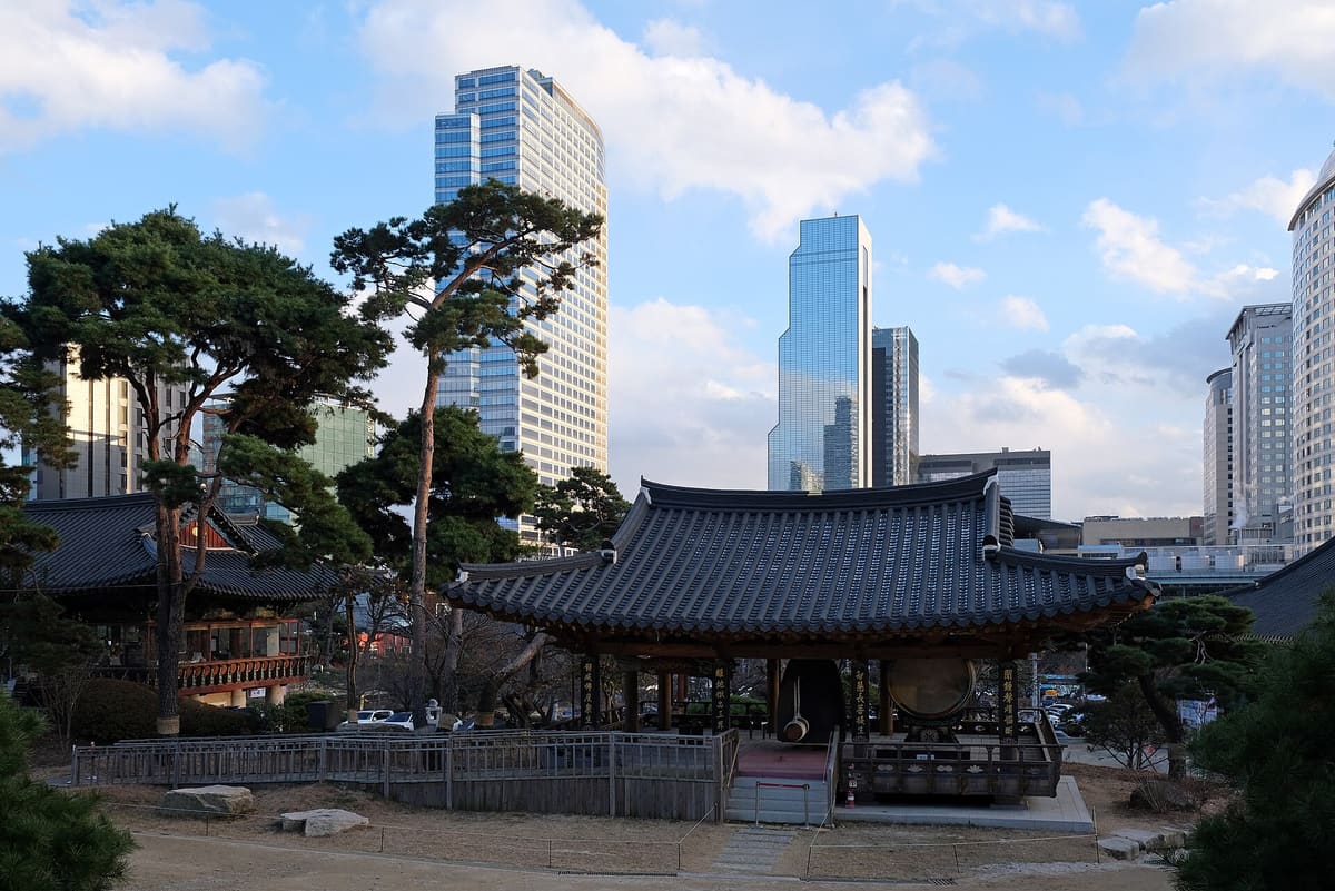A temple hall at Bongeunsa with the Gangnam towers behind