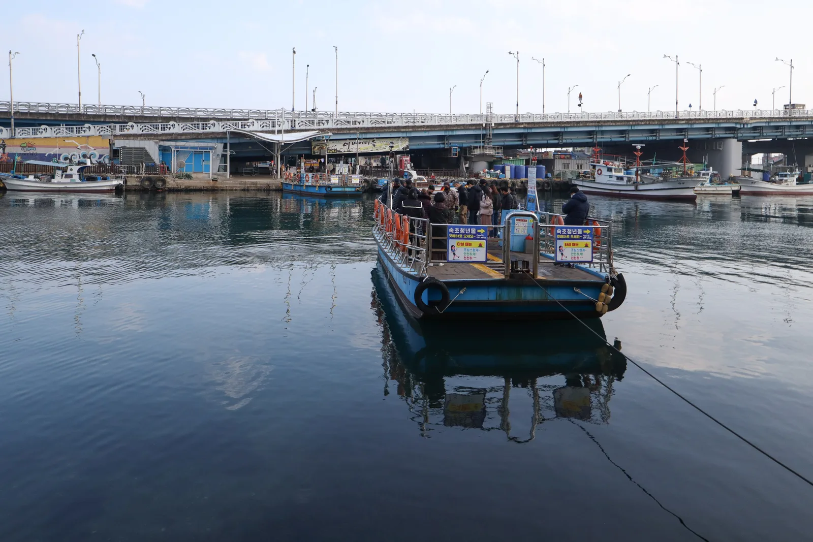 The hand-pulled gaetbae ferry crossing Sokcho Port channel between downtown and Abai Village