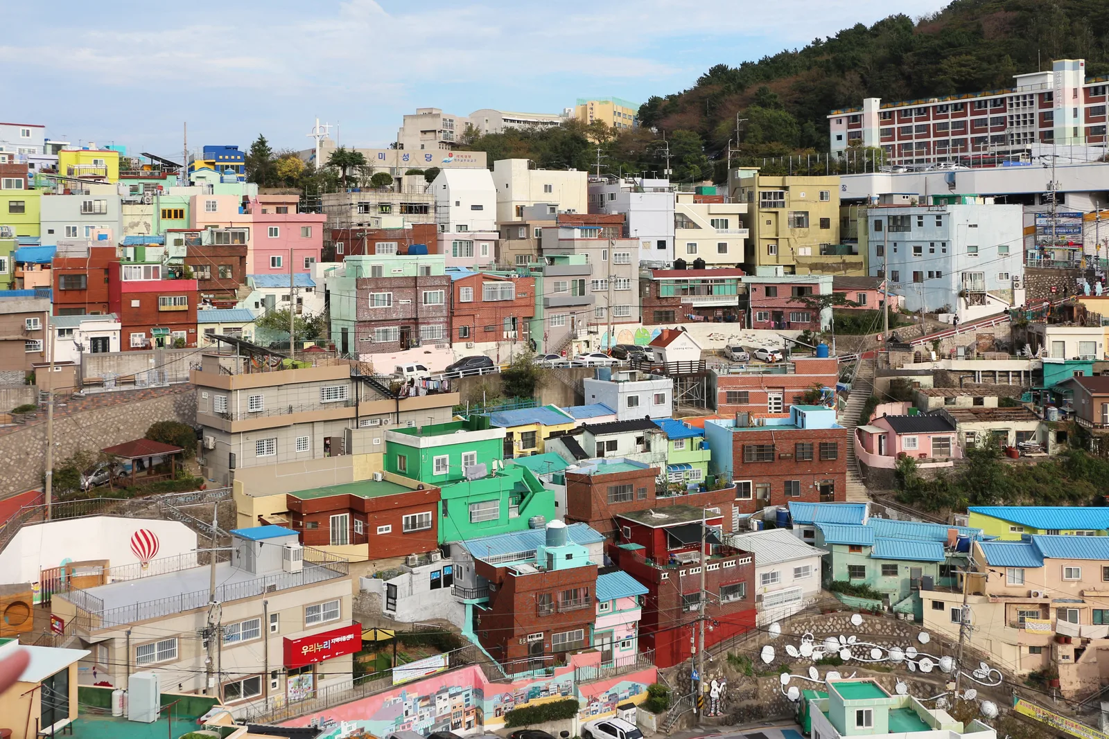 Colourful hillside houses and stepped lanes filling the valley at Gamcheon Culture Village in Busan