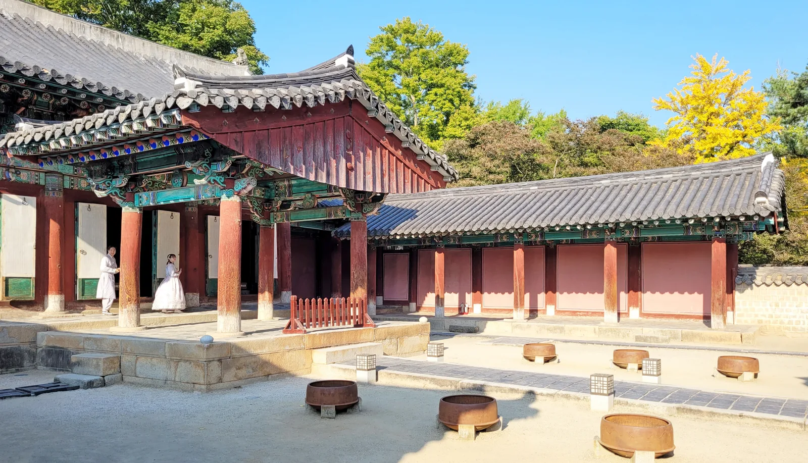 The painted timber shrine hall and stone courtyard inside Gyeonggijeon in Jeonju