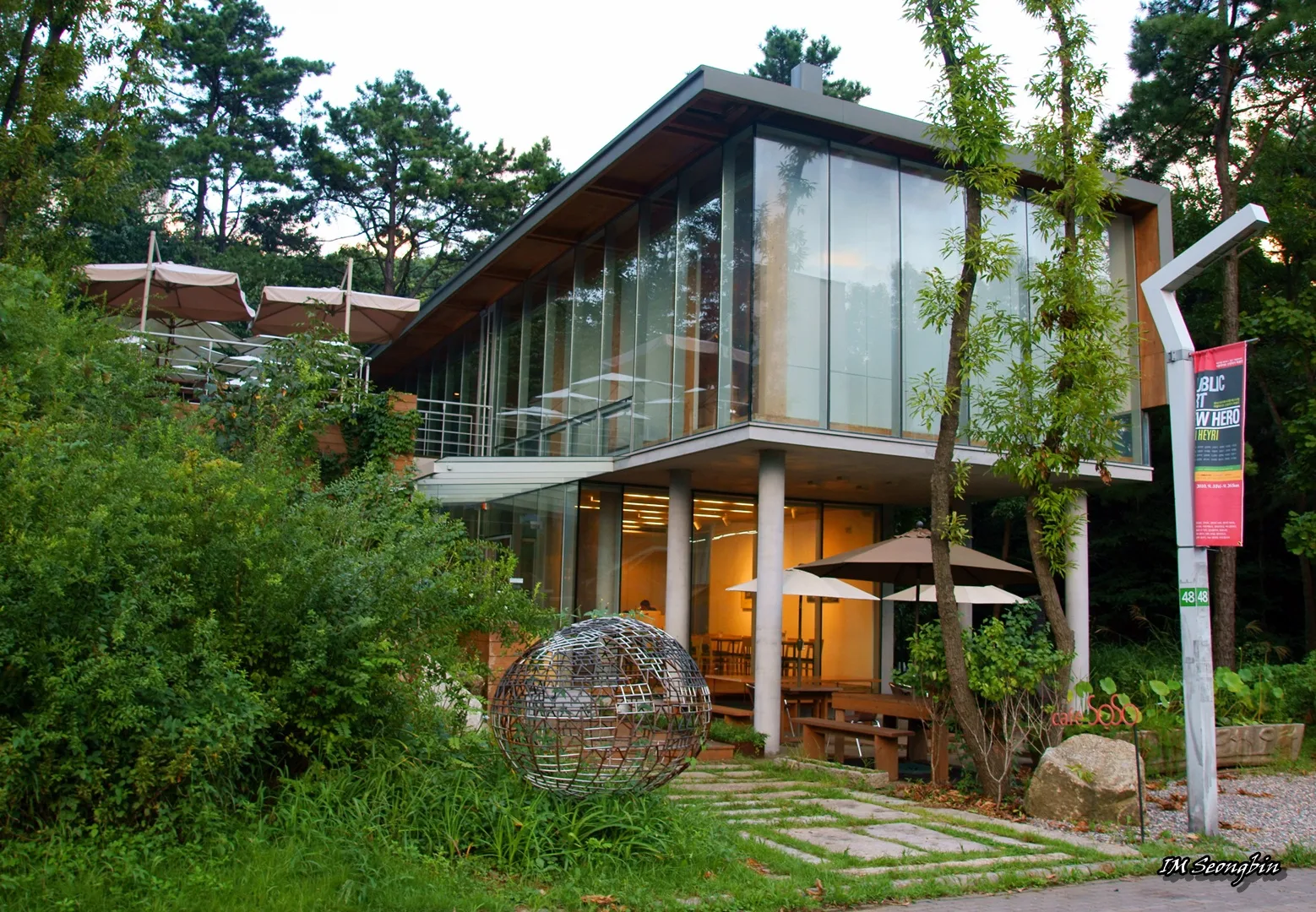 The glass-fronted Gallery SoSo among the trees and art spaces of Heyri Art Valley in Paju