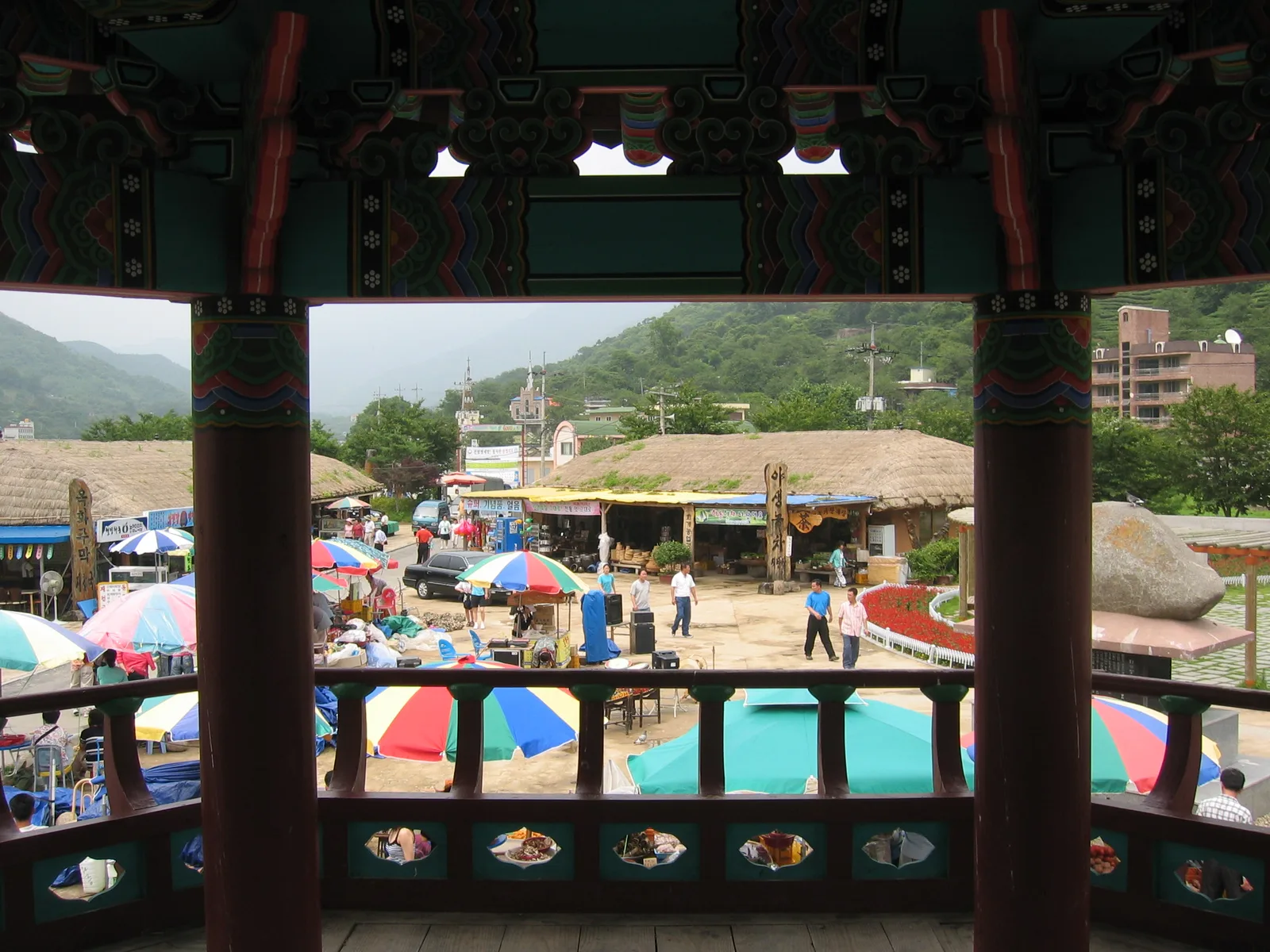 Market stalls and the traditional entrance gate at Hwagae Market near Jirisan in Hadong