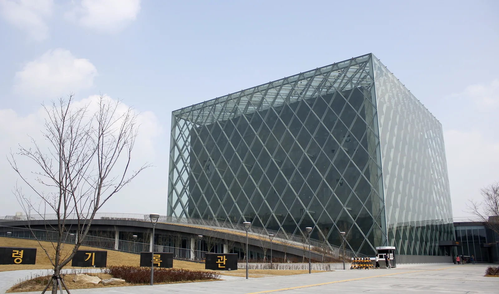 The cube-shaped glass Presidential Archives building and entrance forecourt in Sejong