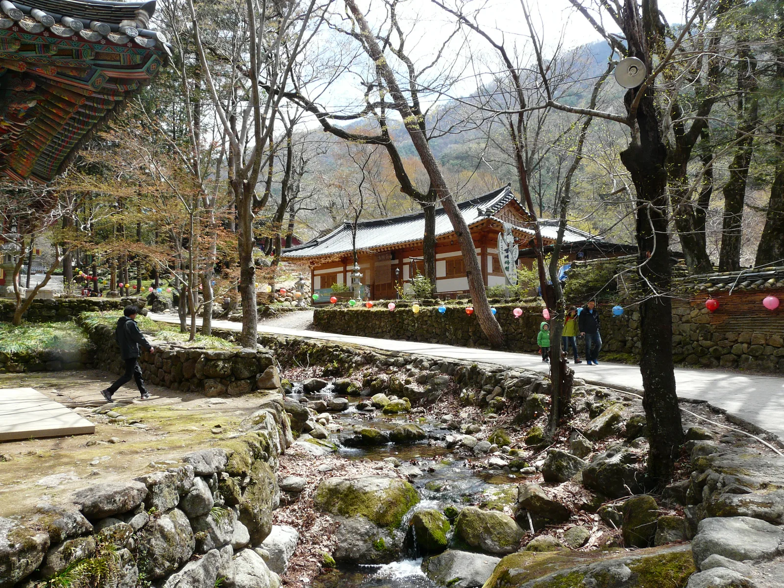 A mountain stream running beside traditional buildings inside Ssanggyesa Temple in Hadong