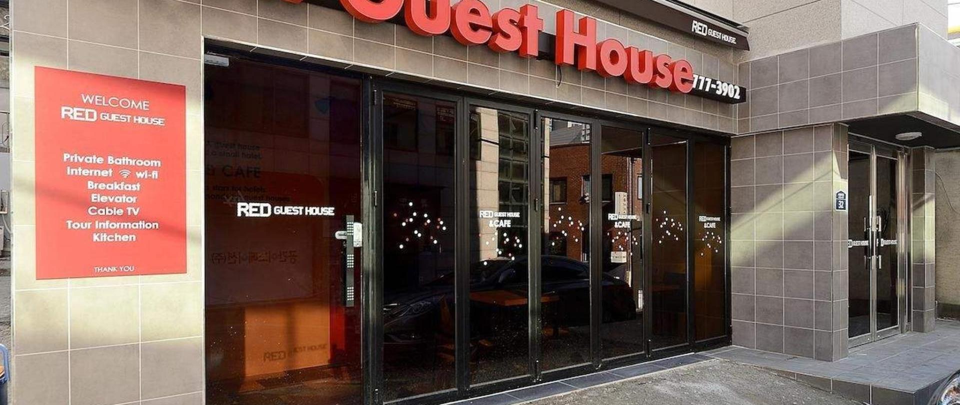 Signed street entrance of Red Guesthouse Myeongdong
