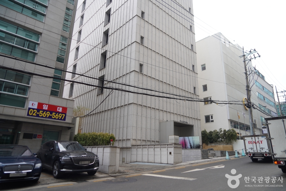 Entrance and stone exterior of Owall Hotel in Yeoksam