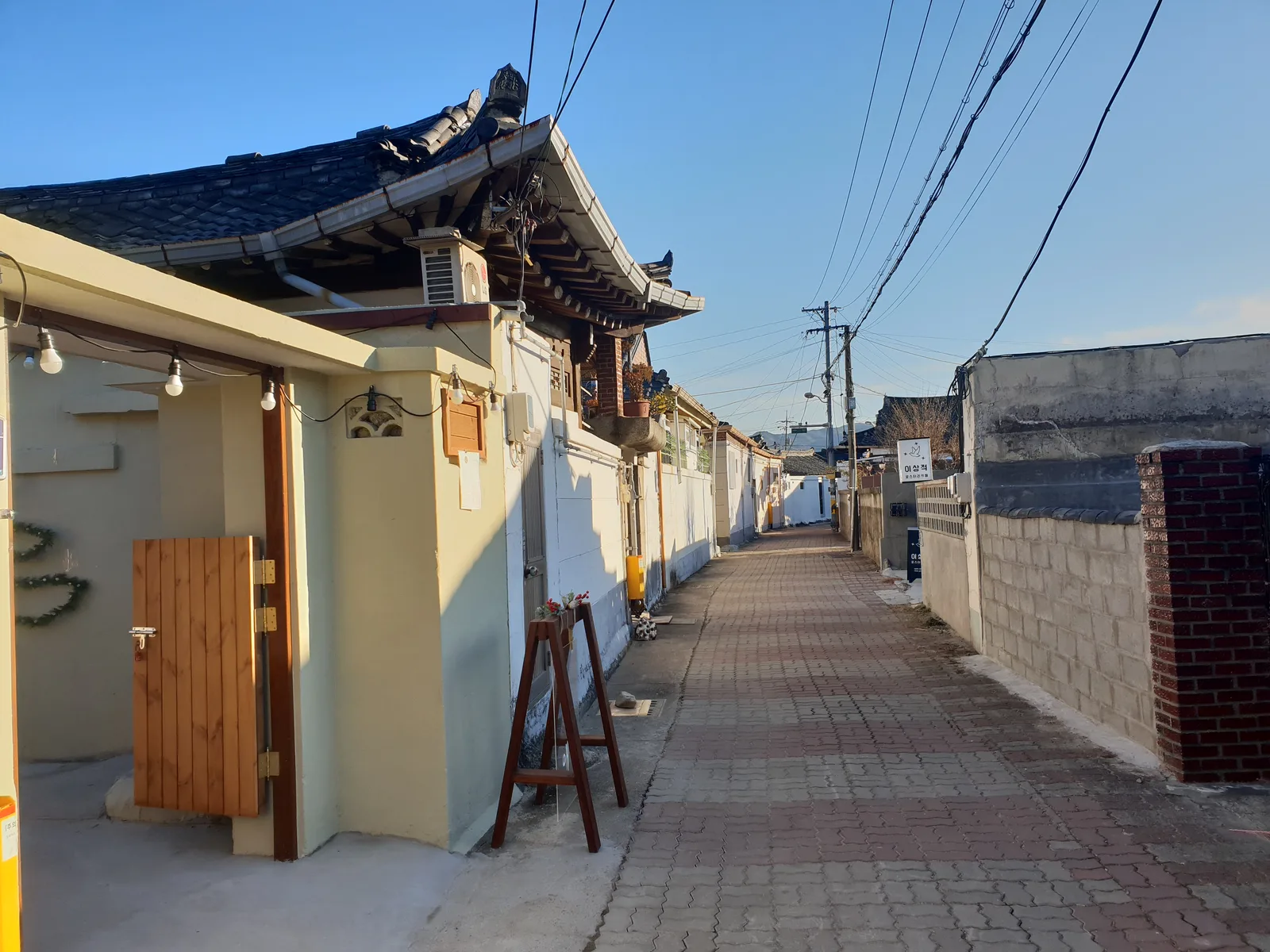 A pedestrian lane of converted hanok buildings and small shops in Gyeongju's Hwangridan-gil district