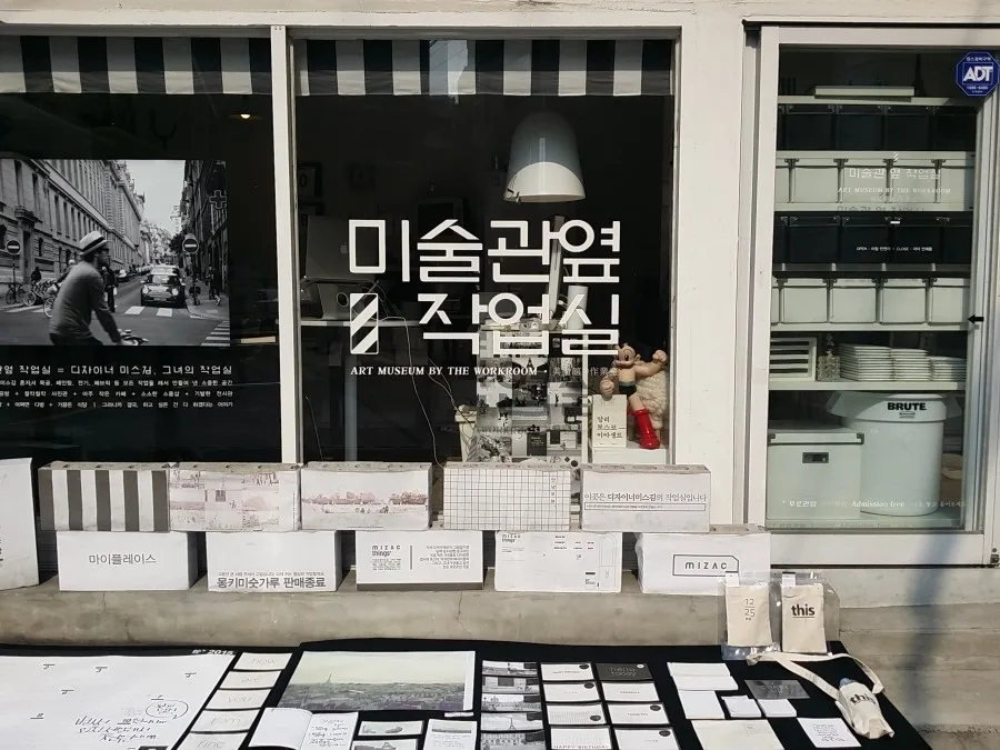 A small art and design storefront display photographed in Seochon Village, Seoul