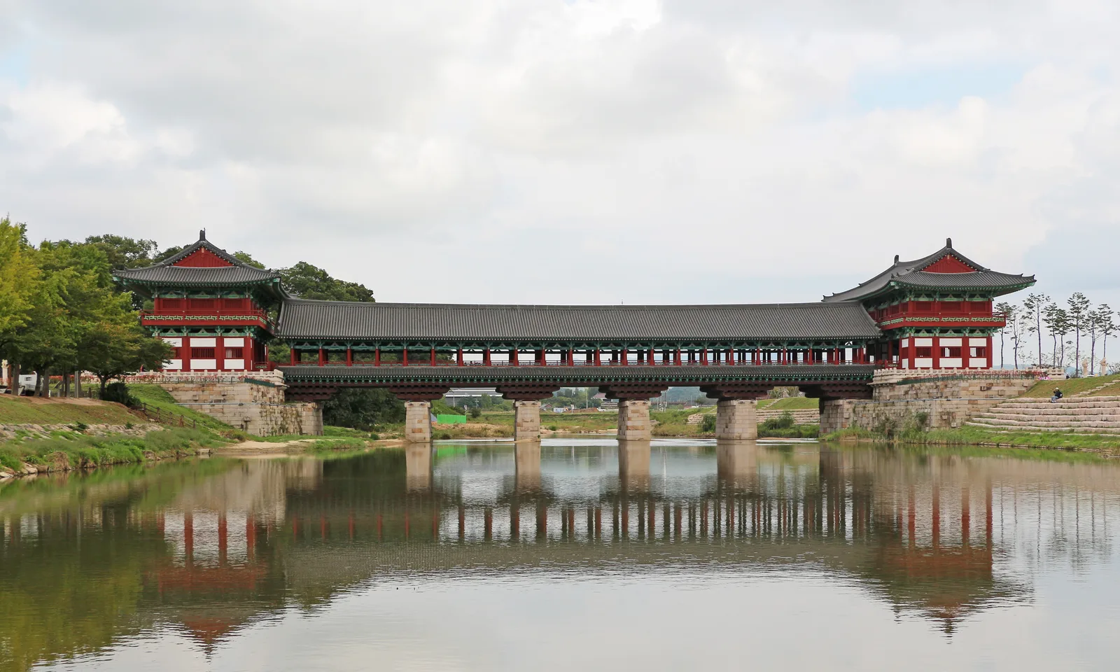 The reconstructed Woljeonggyo Bridge and twin gatehouses reflected in Namcheon in Gyeongju