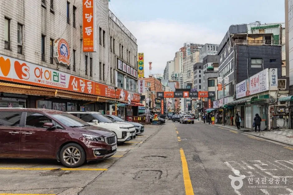 Restaurant signs and the entrance lane of Shindang-dong Tteokbokki Town in Seoul